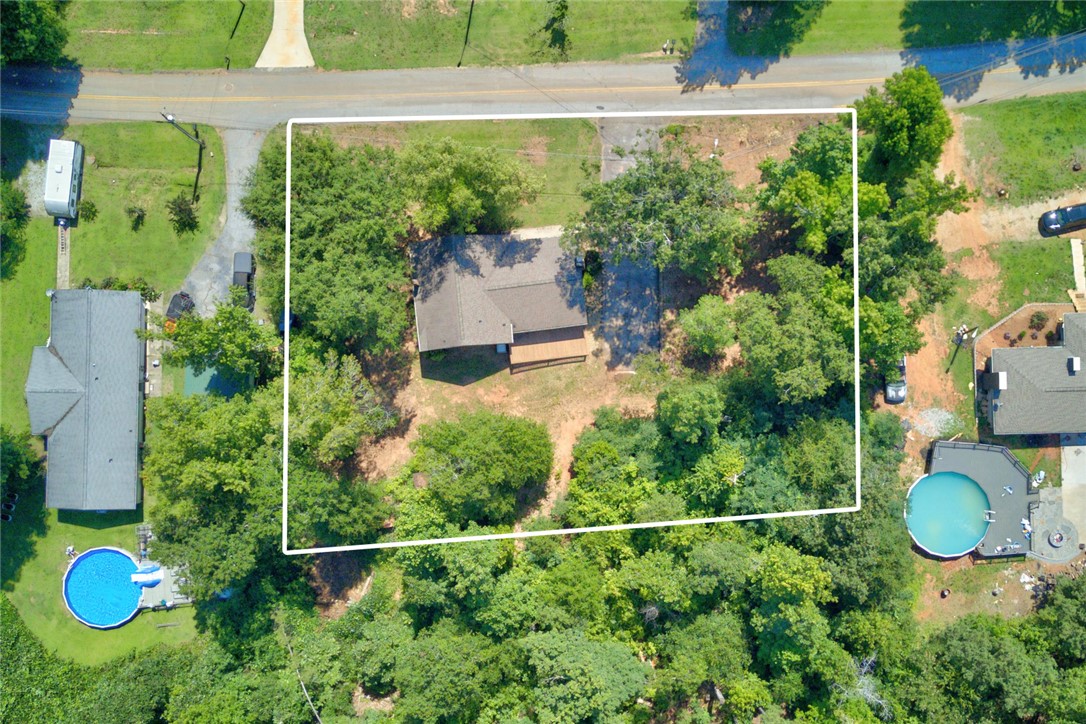 712 Beech Drive Seneca, SC 29678 - Photo 38 of 41 An aerial perspective reveals a private home nestled amidst a verdant landscape with direct road access.