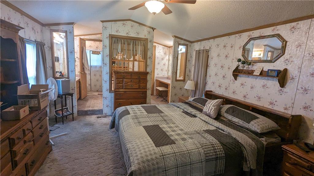 542 Finks Run Road McDonald, PA 15057 - Photo 23 of 28 a bedroom with a bed and a chandelier