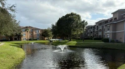 a view of a lake with a house in the background
