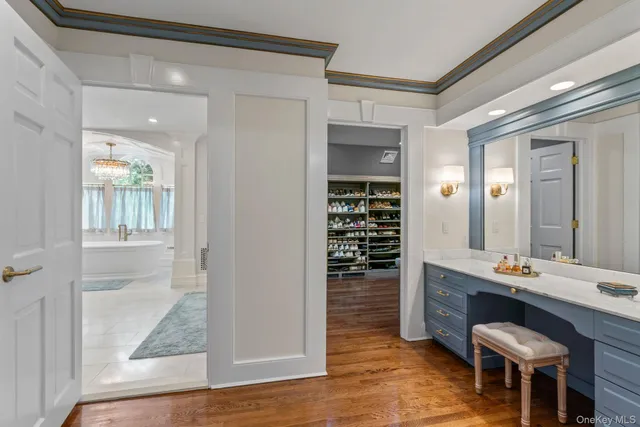 a room with wooden floor and furniture