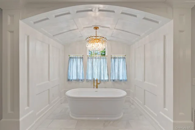 a bathroom with a sink and a window