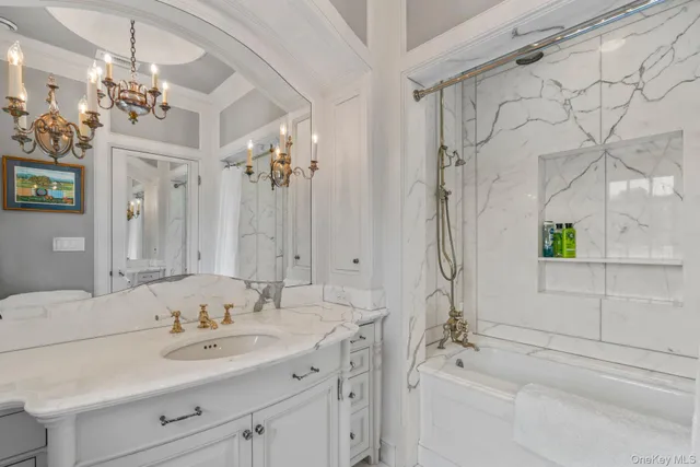 a bathroom with a shower sink and mirror