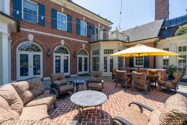 a view of a building with furniture and tables