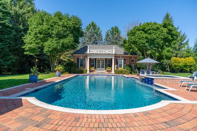 a living room with furniture a window and a chandelier