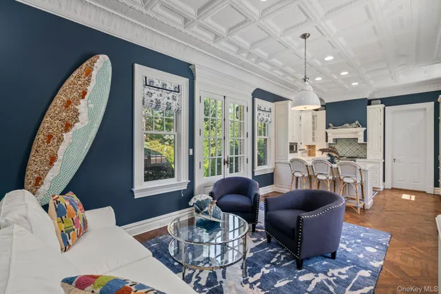 a very nice looking living room with a baby crib