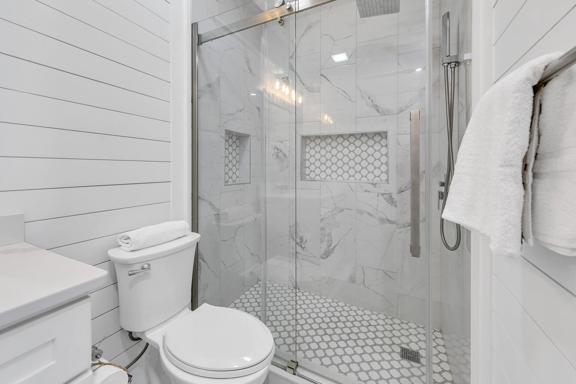 3604 East County Highway 30A, Unit B8 Santa Rosa Beach, FL 32459 - Photo 17 of 39 a white toilet sitting next to a bathroom