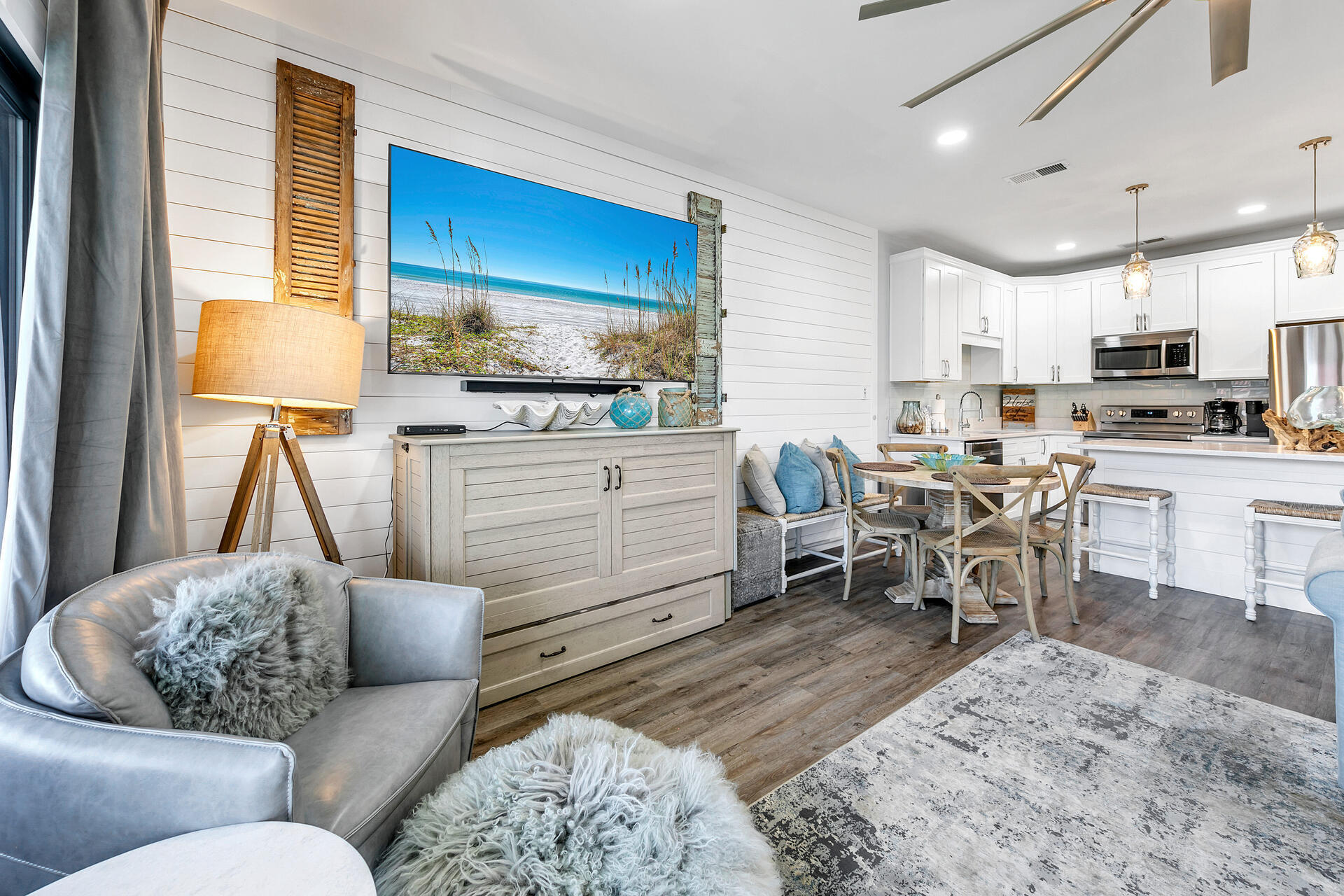 3604 East County Highway 30A, Unit B8 Santa Rosa Beach, FL 32459 - Photo 2 of 39 a living room with furniture and a dining table with kitchen appliances