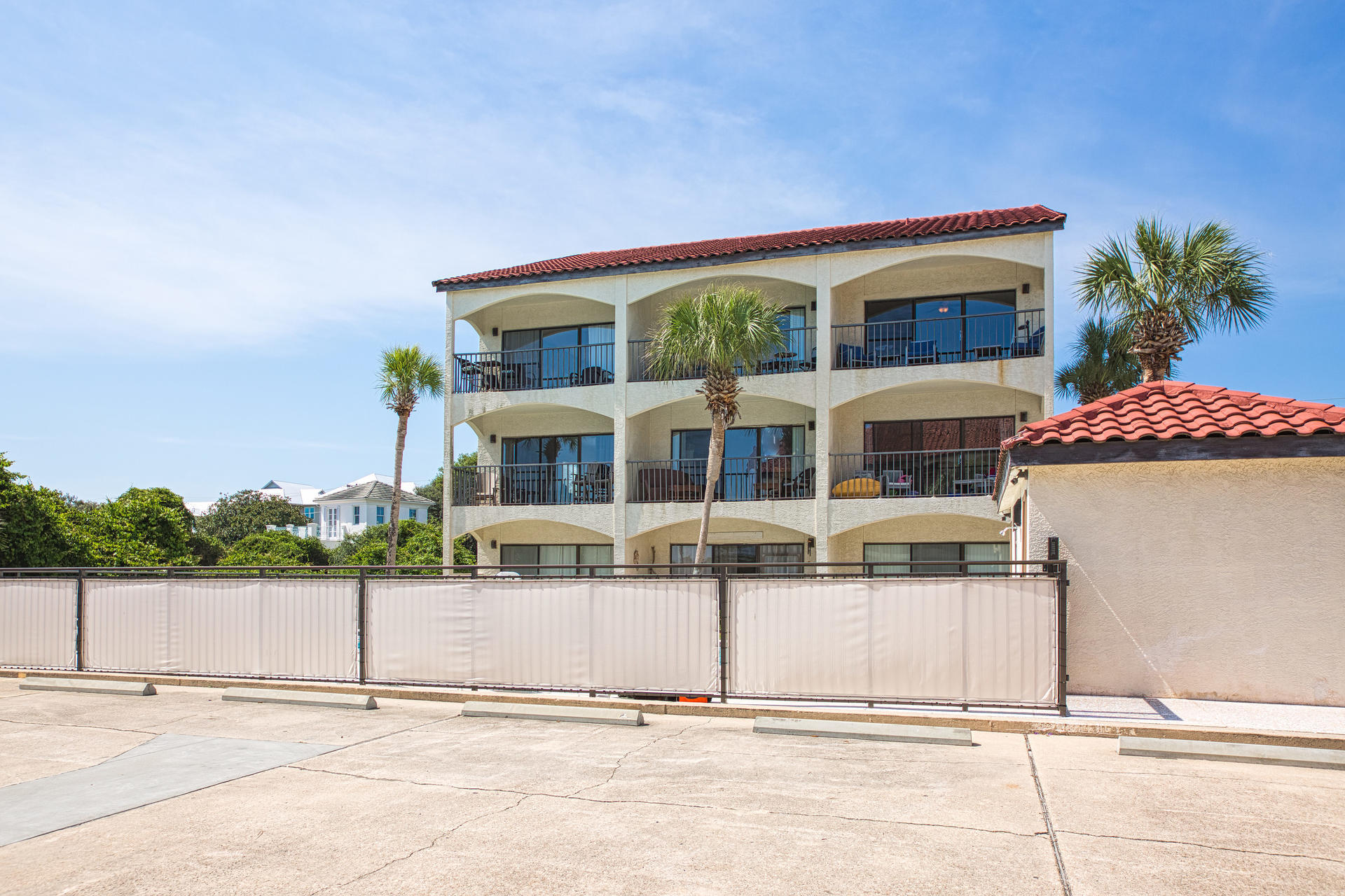 3604 East County Highway 30A, Unit B8 Santa Rosa Beach, FL 32459 - Photo 23 of 39 a front view of a house with a yard