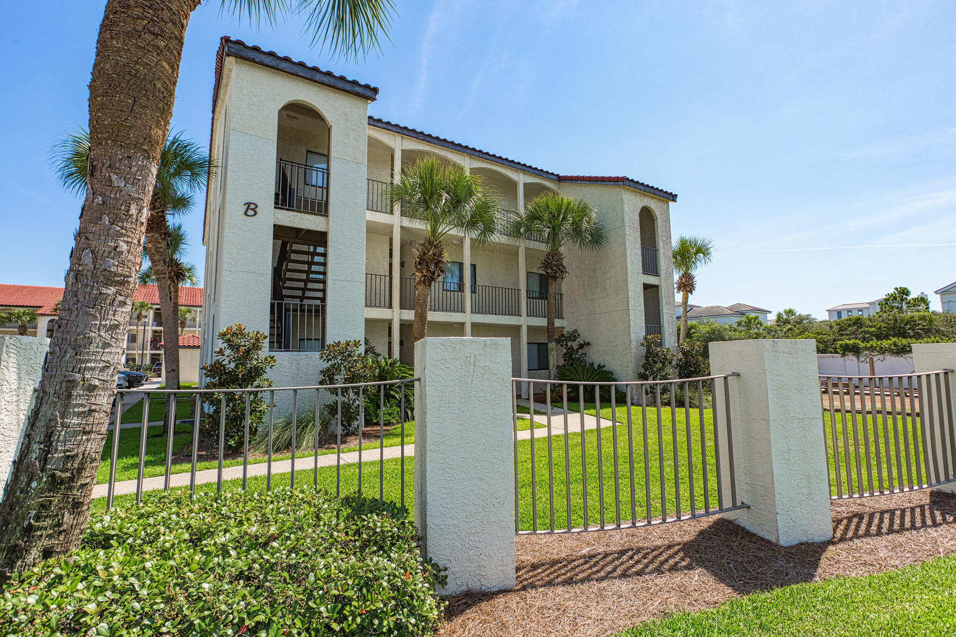 3604 East County Highway 30A, Unit B8 Santa Rosa Beach, FL 32459 - Photo 26 of 39 front view of a house with a small yard