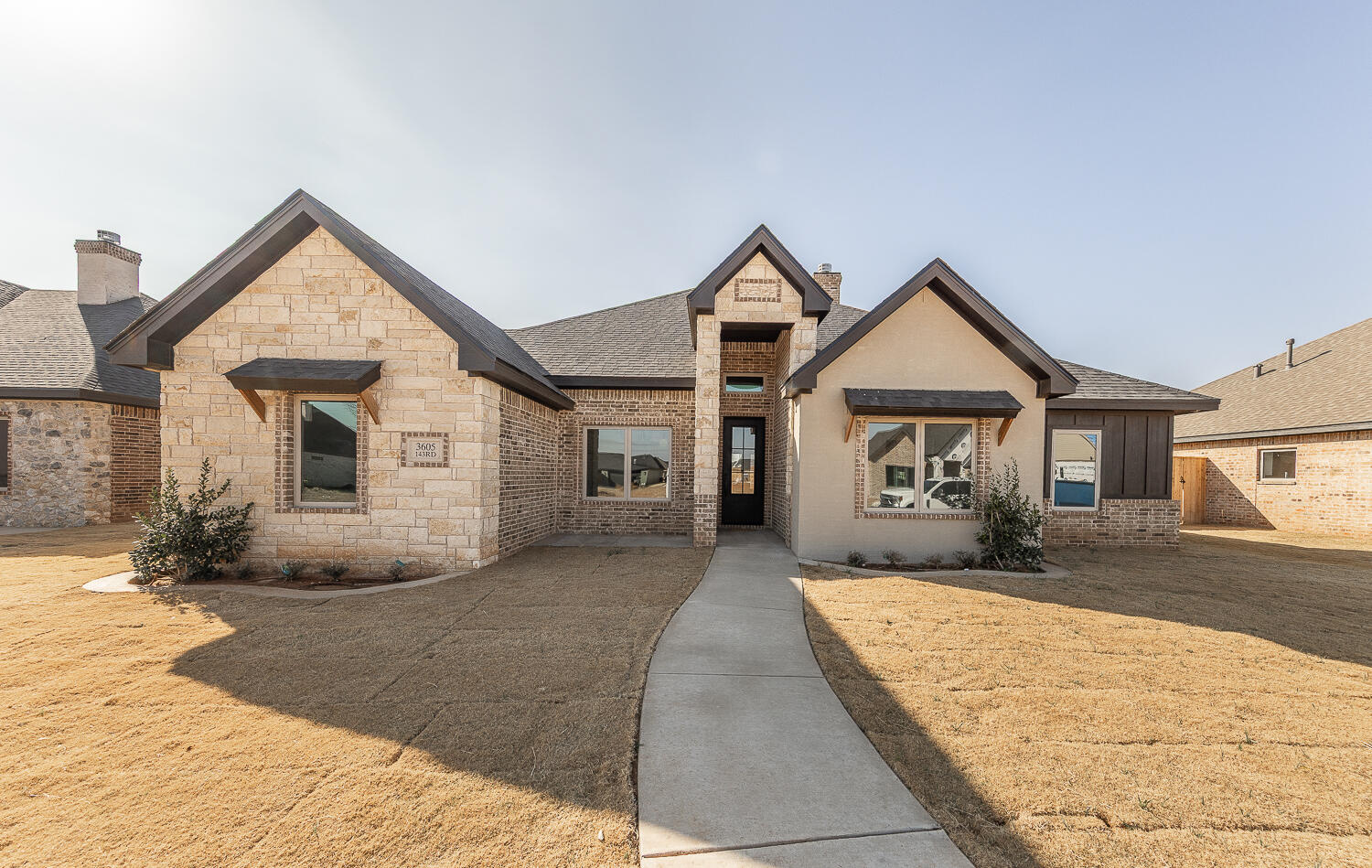3605 143rd Street Lubbock, TX 79423 - Photo 1 of 34 a front view of a house with yard