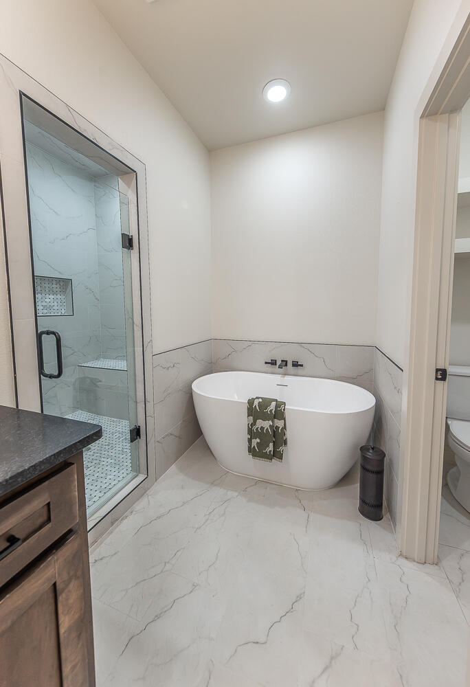 3605 143rd Street Lubbock, TX 79423 - Photo 17 of 34 a view of a bathtub in a bathroom