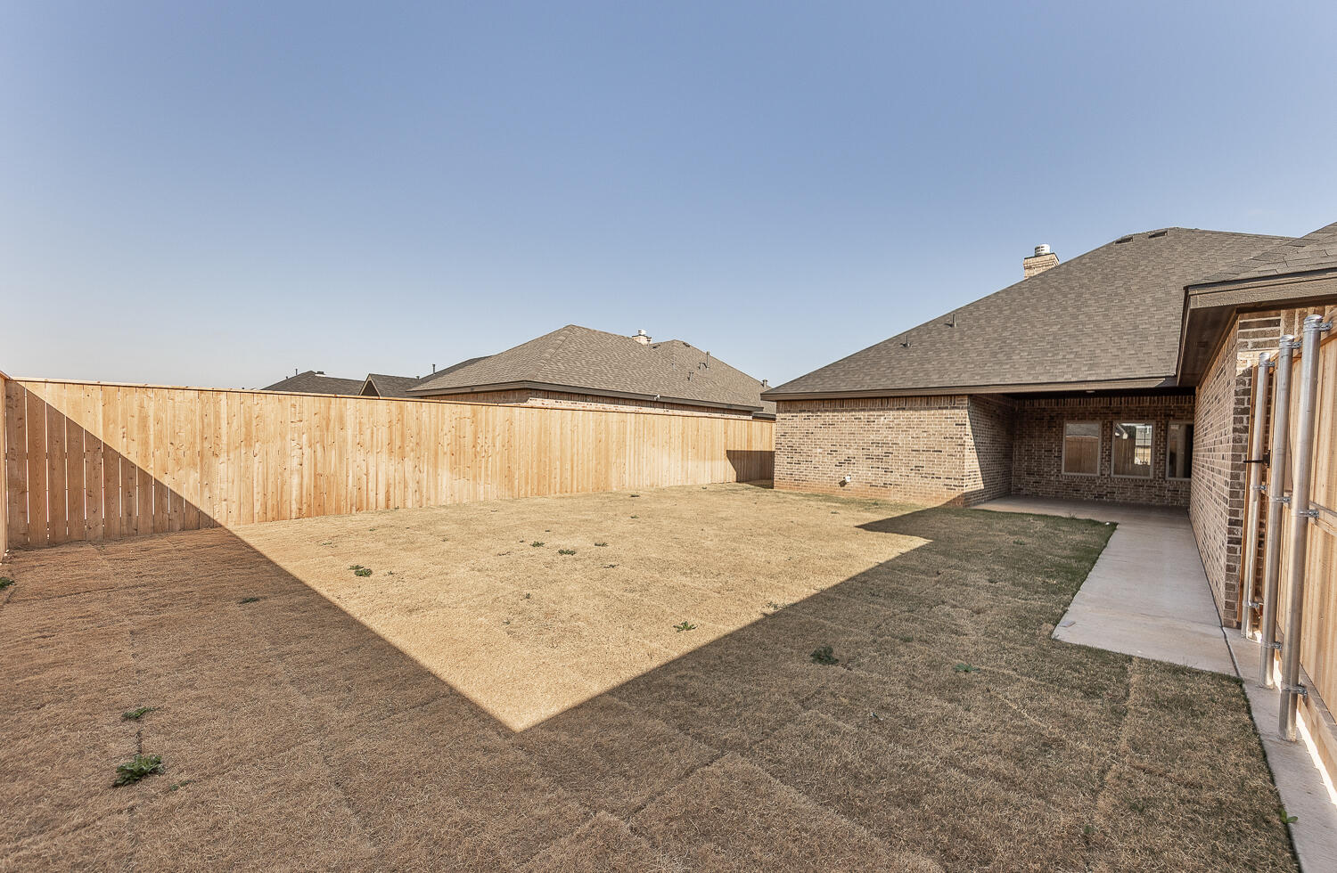 3605 143rd Street Lubbock, TX 79423 - Photo 31 of 34 a view of a house with a backyard