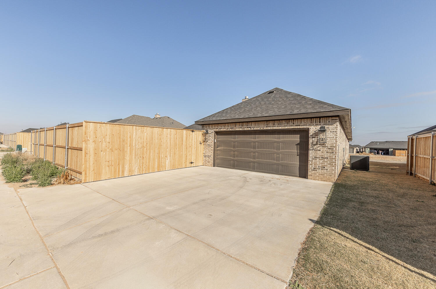 3605 143rd Street Lubbock, TX 79423 - Photo 33 of 34 a front view of a house with a yard