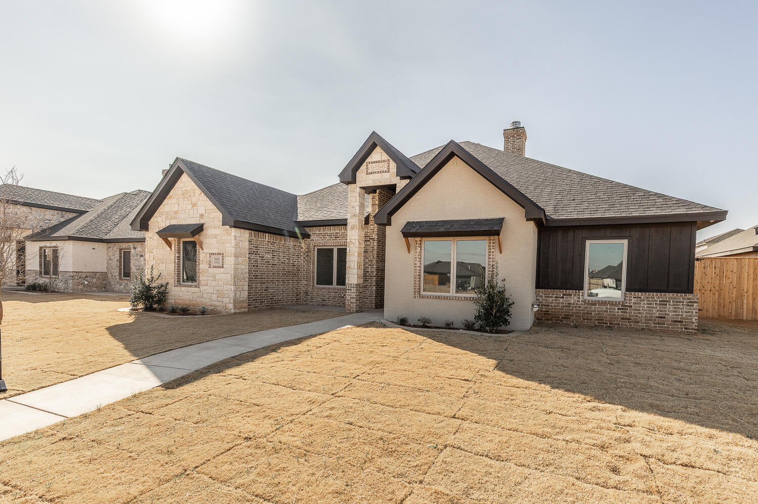 3605 143rd Street Lubbock, TX 79423 - Photo 34 of 34 a front view of a house with a yard and garage