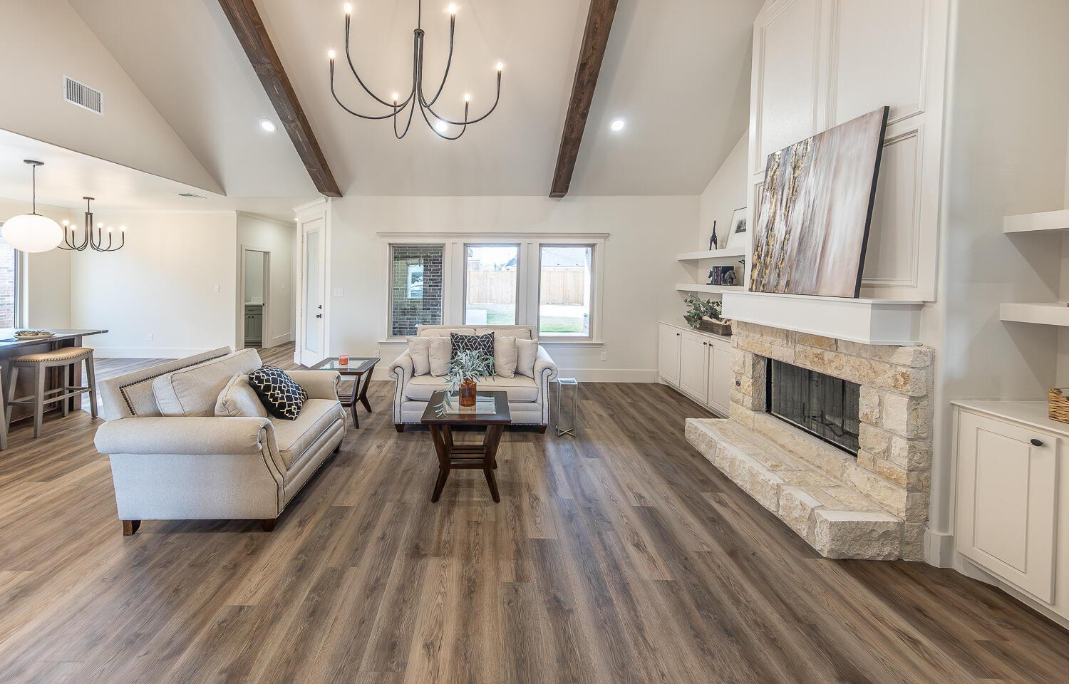3605 143rd Street Lubbock, TX 79423 - Photo 6 of 34 a living room with furniture and a fireplace