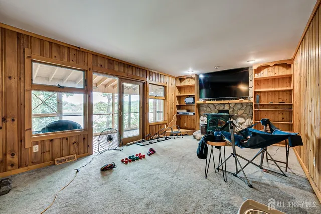 a room with furniture and large windows