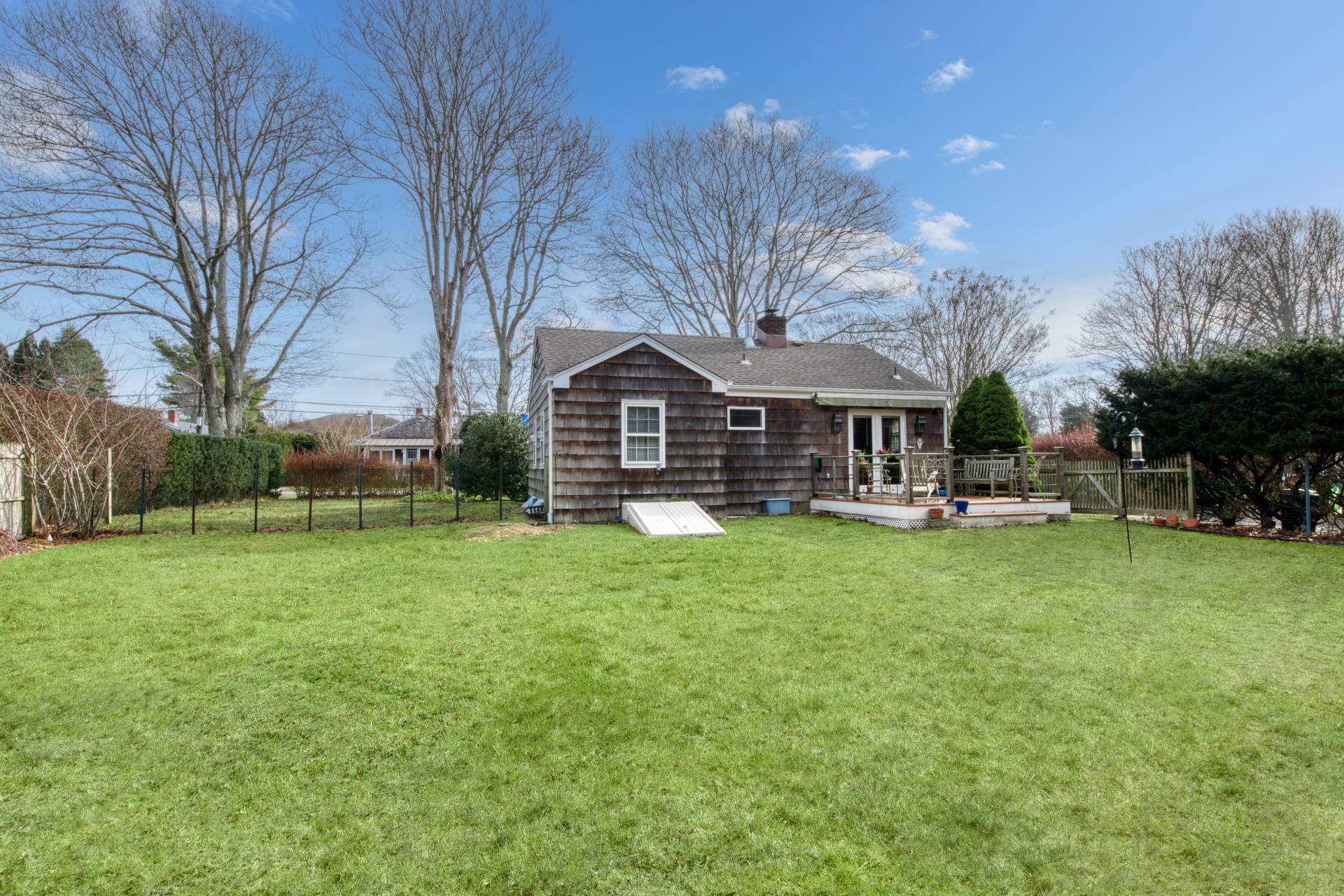 11 Maidstone Avenue East Hampton, NY 11937 - Photo 15 of 15 a front view of house with yard and green space