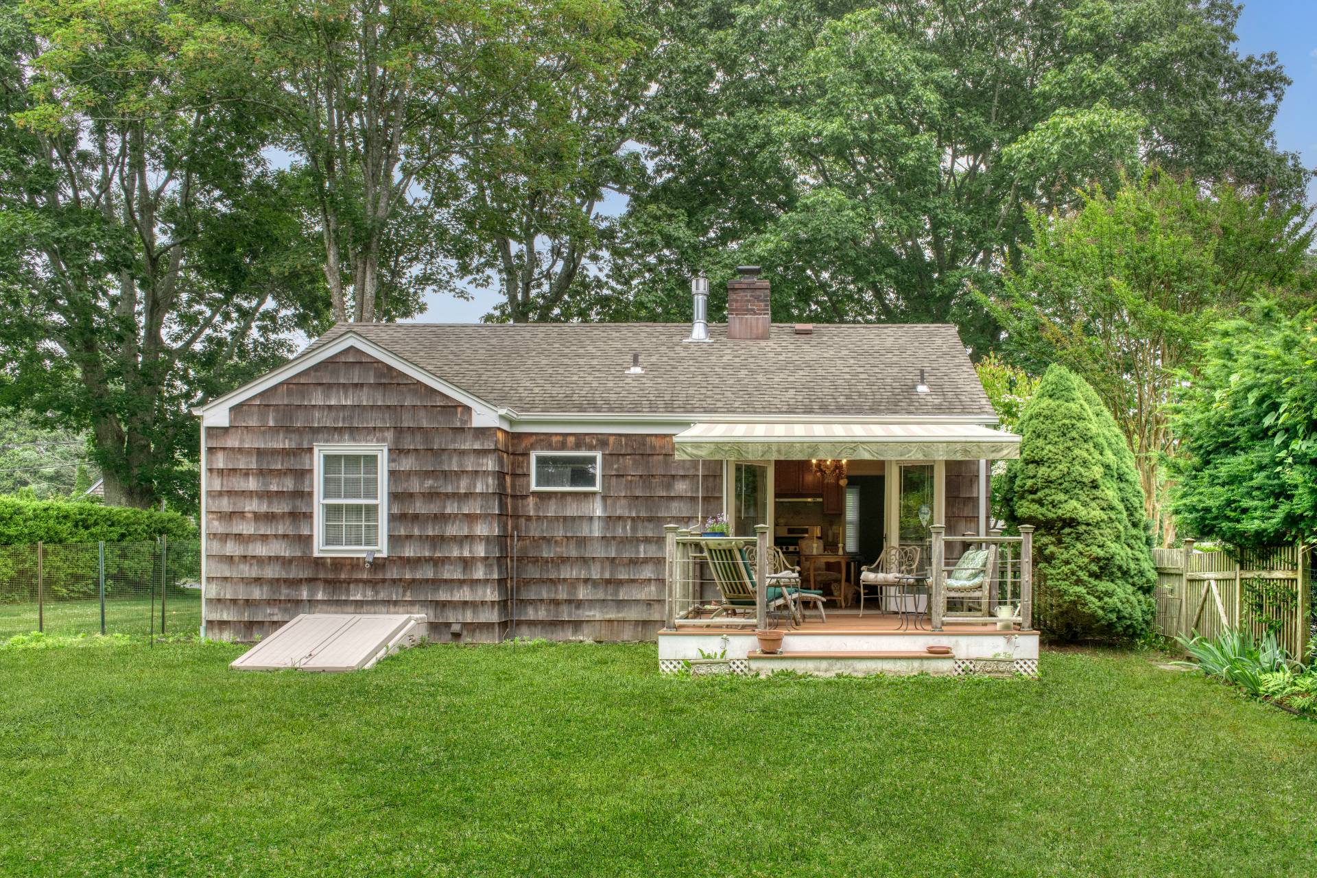 11 Maidstone Avenue East Hampton, NY 11937 - Photo 2 of 15 a view of a house with a backyard porch and sitting area