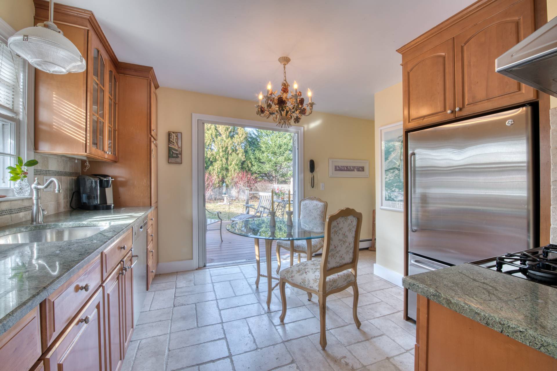 11 Maidstone Avenue East Hampton, NY 11937 - Photo 7 of 15 a kitchen with granite countertop a refrigerator a stove a sink and dishwasher
