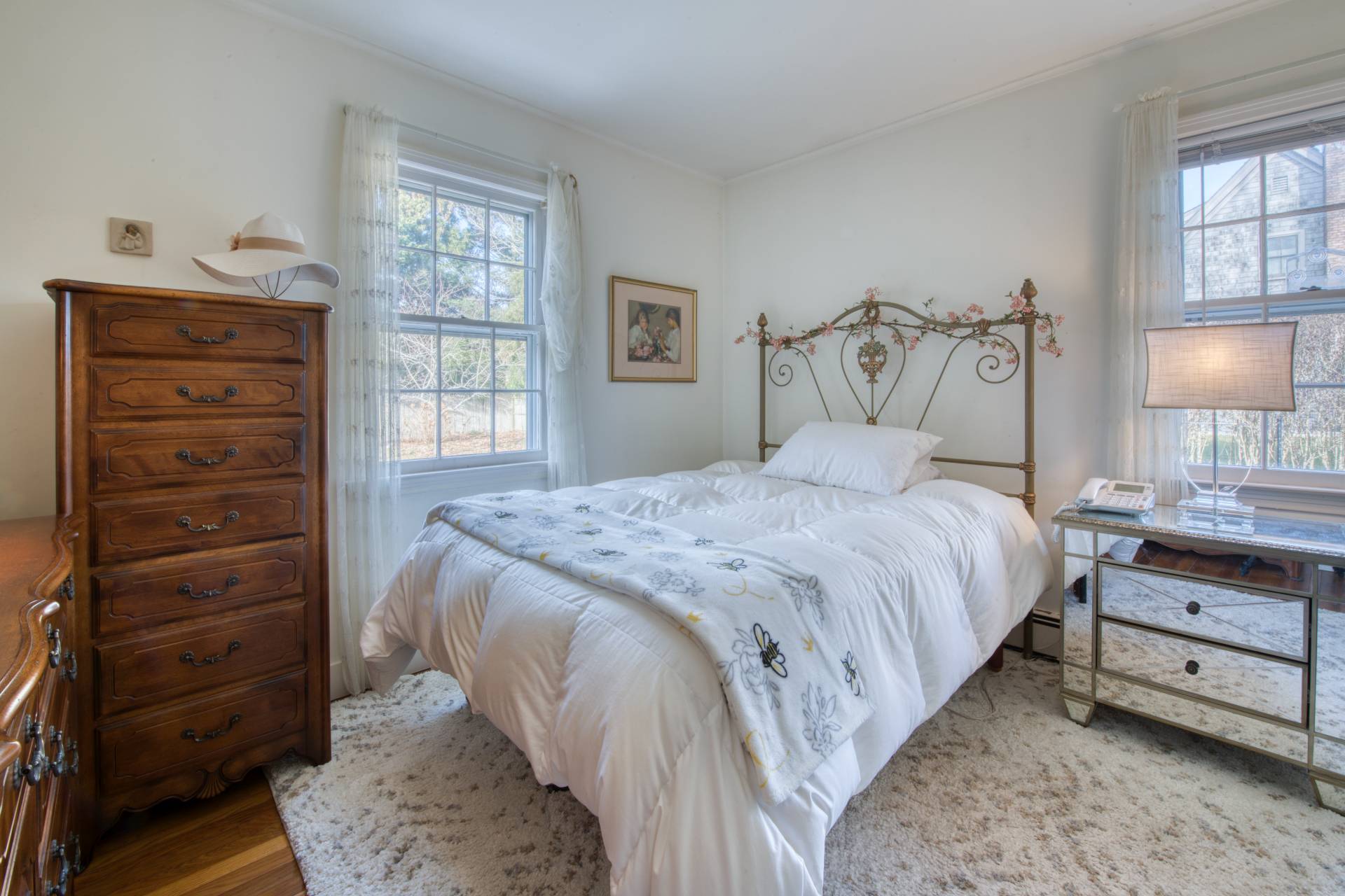 11 Maidstone Avenue East Hampton, NY 11937 - Photo 8 of 15 a bedroom with a bed and a dresser
