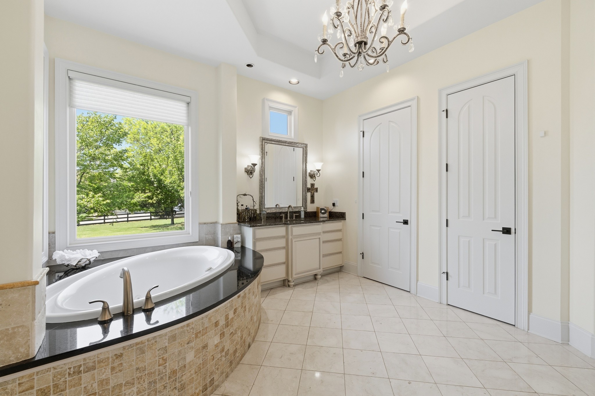 4606 Shores Road Murfreesboro, TN 37128 - Photo 33 of 74 a spacious bathroom with a tub double vanity window and mirror
