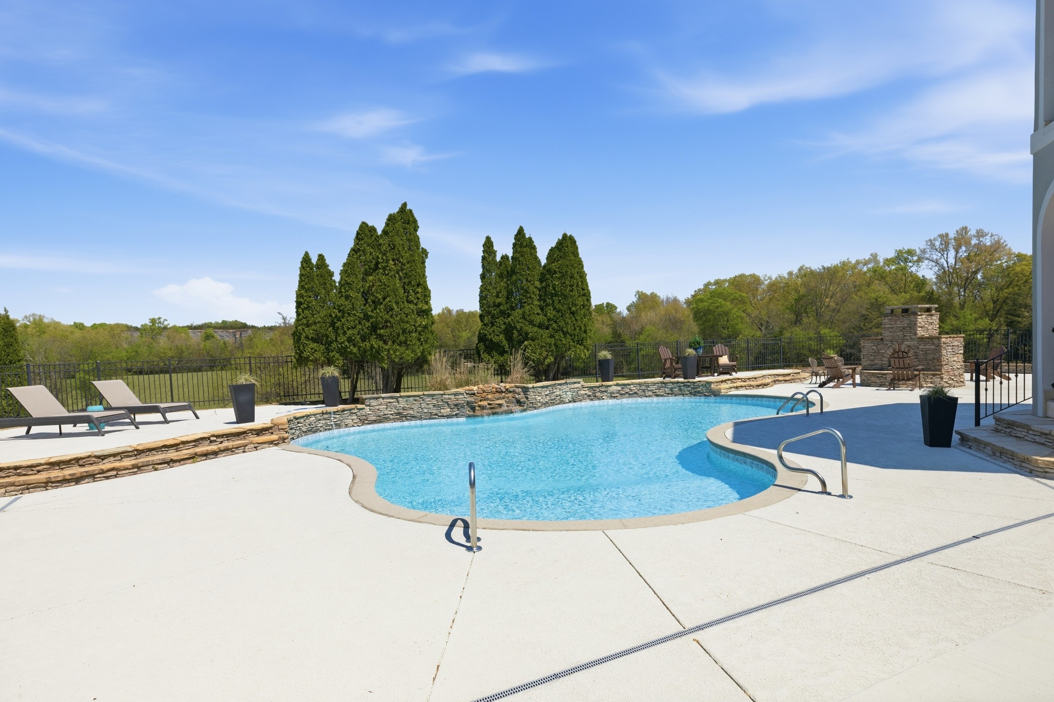 4606 Shores Road Murfreesboro, TN 37128 - Photo 52 of 74 a view of a swimming pool with a lounge chair