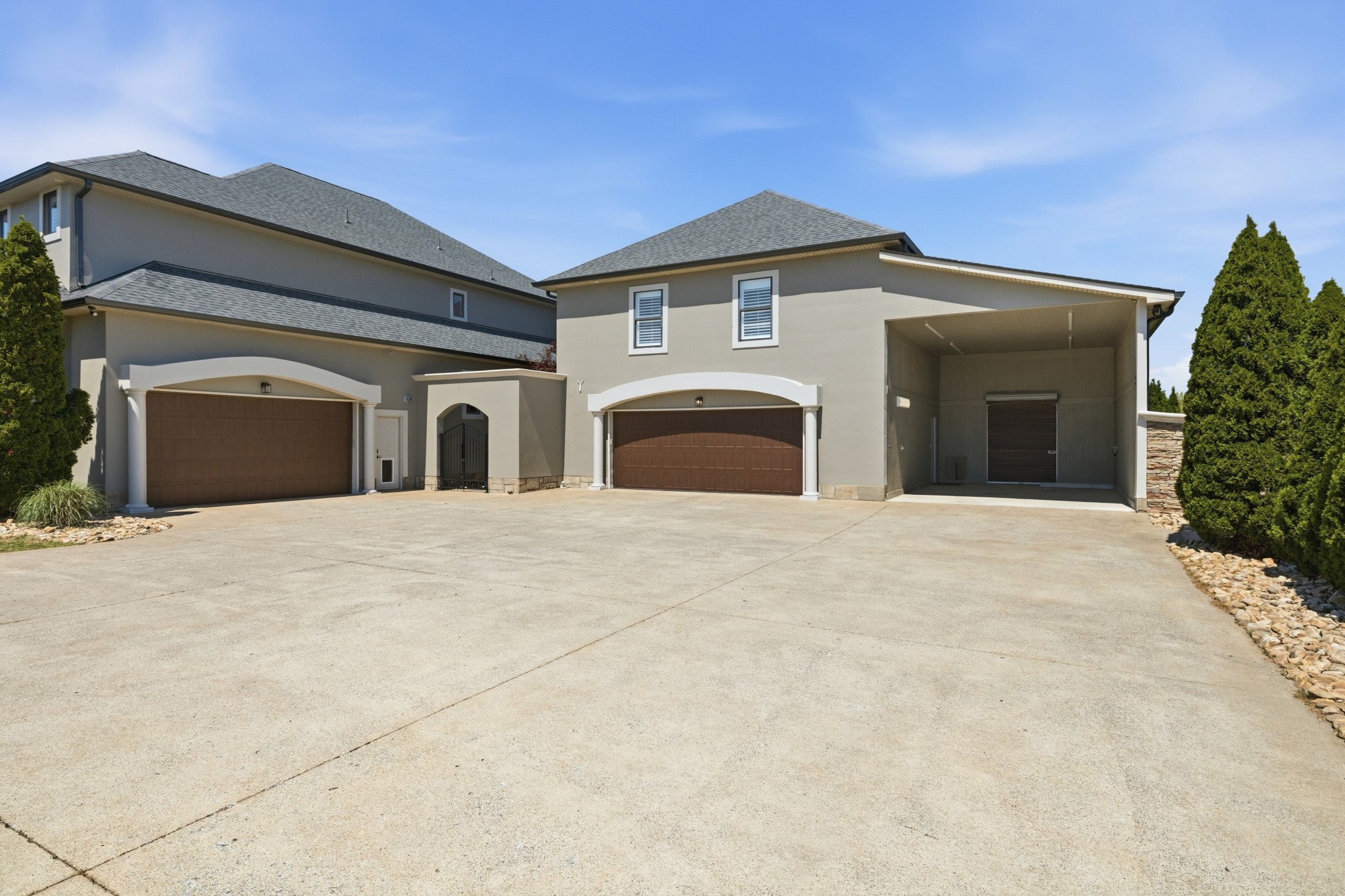 4606 Shores Road Murfreesboro, TN 37128 - Photo 63 of 74 a view of a white house with a garage