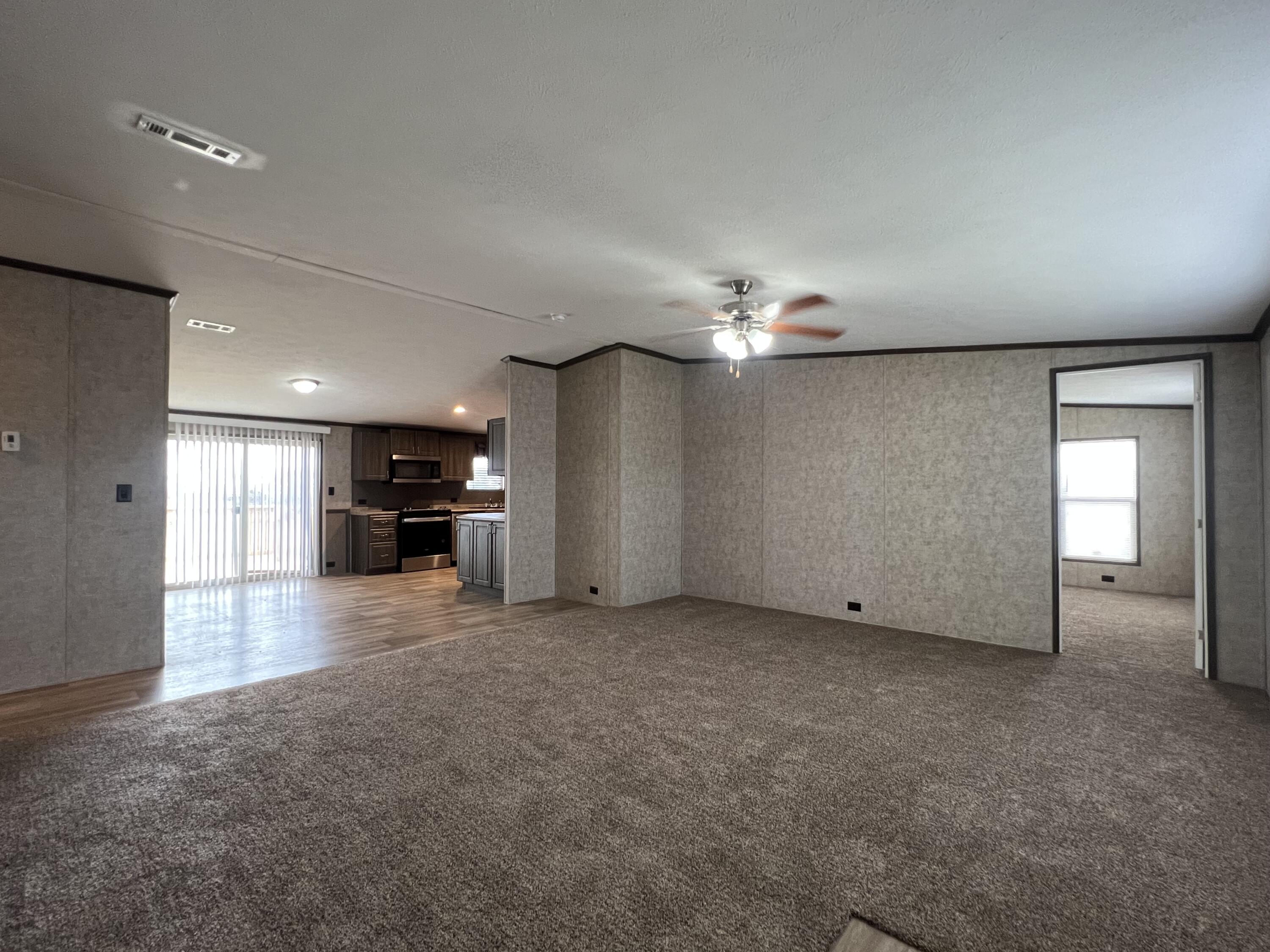 516 May Street Post, TX 79356 - Photo 11 of 31 a view of a livingroom with a kitchen