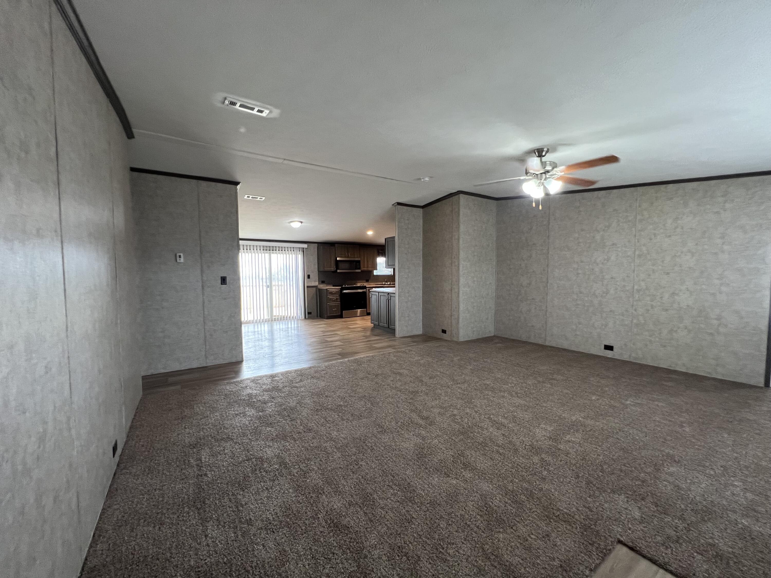 516 May Street Post, TX 79356 - Photo 13 of 31 a view of a hallway with a stove