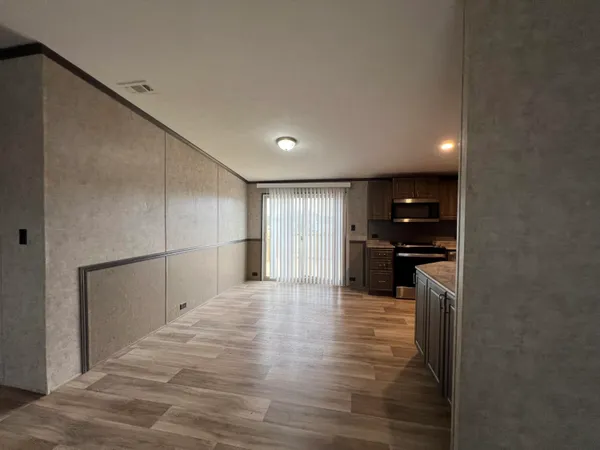 a view of a kitchen with a sink and cabinets