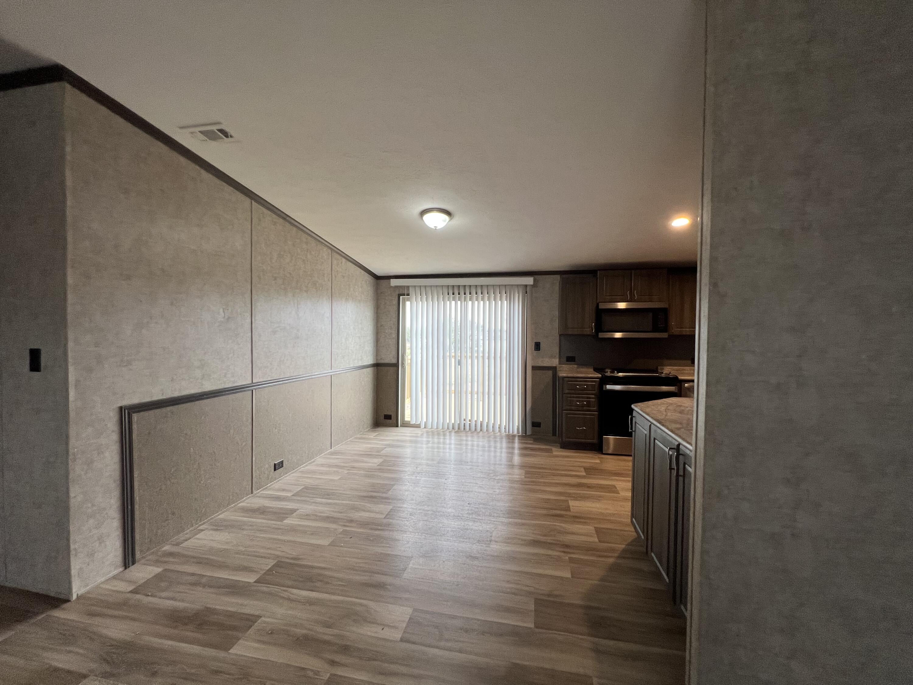516 May Street Post, TX 79356 - Photo 14 of 31 a view of a kitchen with a sink and cabinets