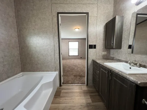 a bathroom with a bathtub and a sink