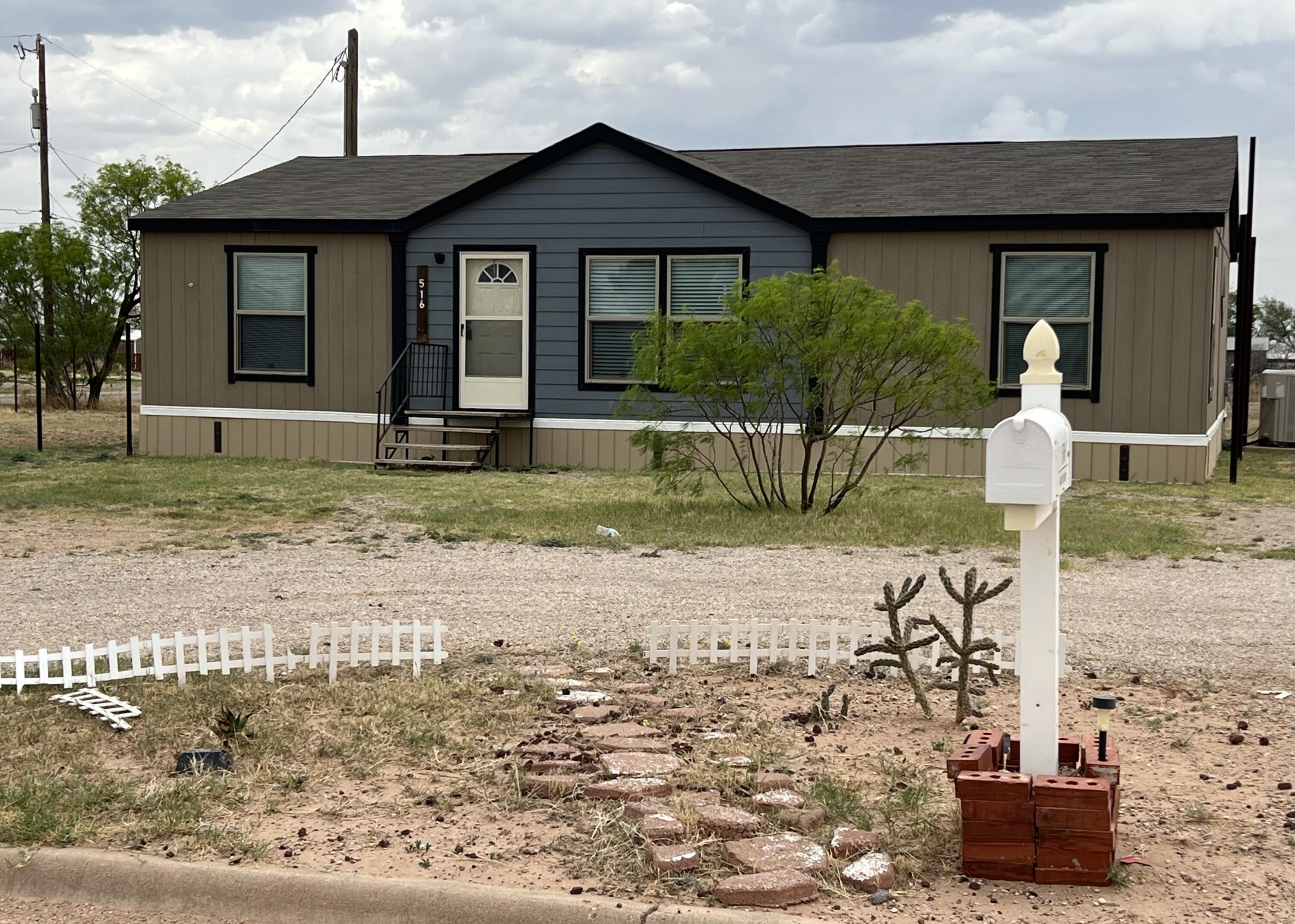 516 May Street Post, TX 79356 - Photo 2 of 31 a front view of a house with garden