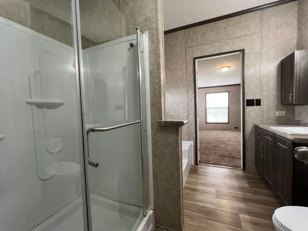 a bathroom with a shower and a mirror