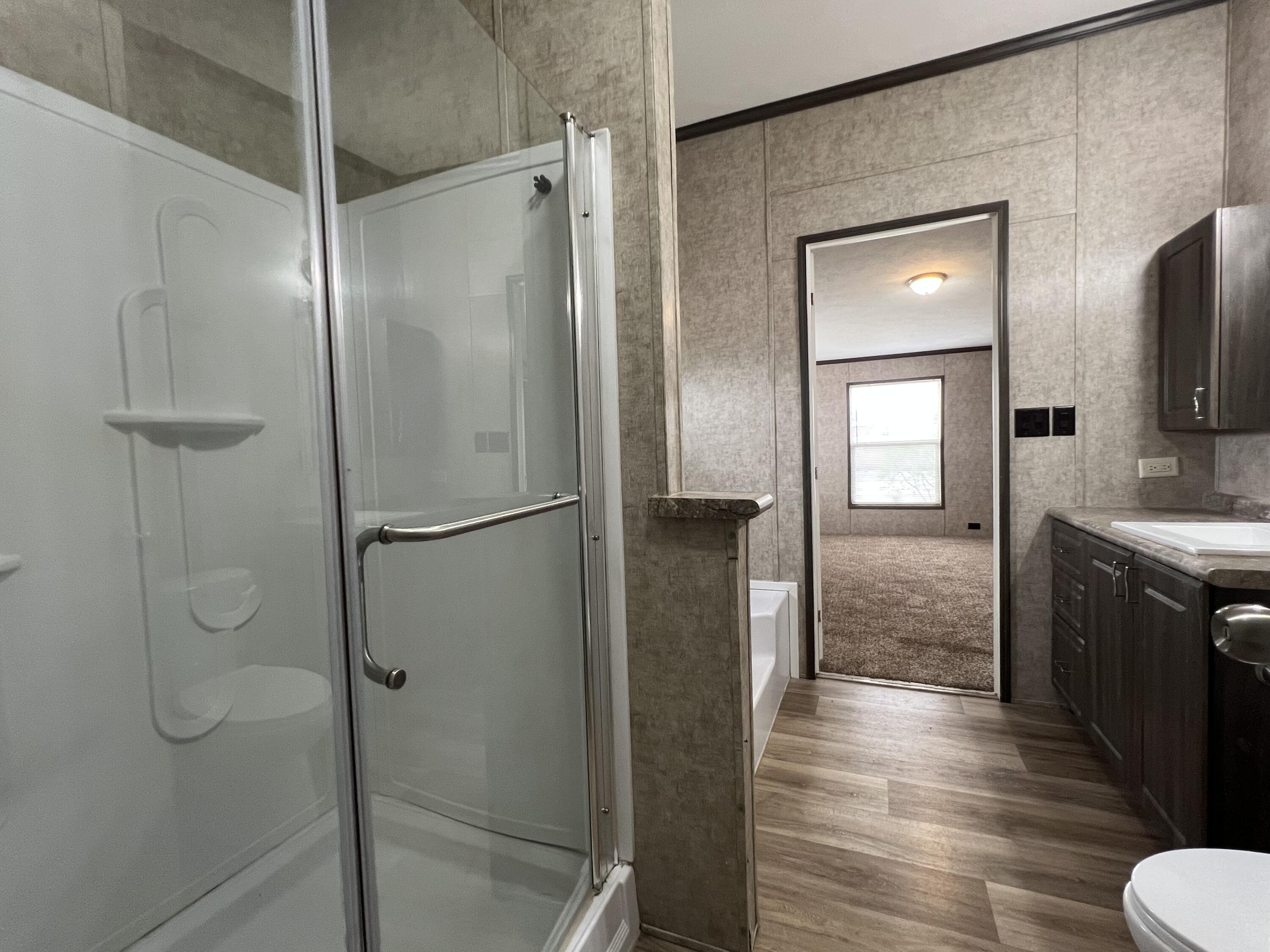 516 May Street Post, TX 79356 - Photo 21 of 31 a bathroom with a shower and a mirror