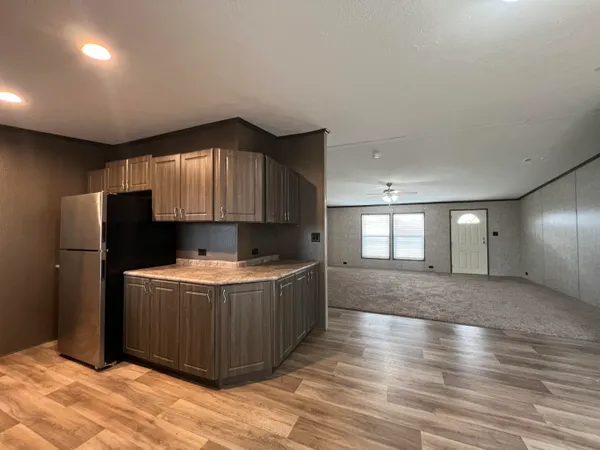 a kitchen with stainless steel appliances granite countertop a stove and a refrigerator