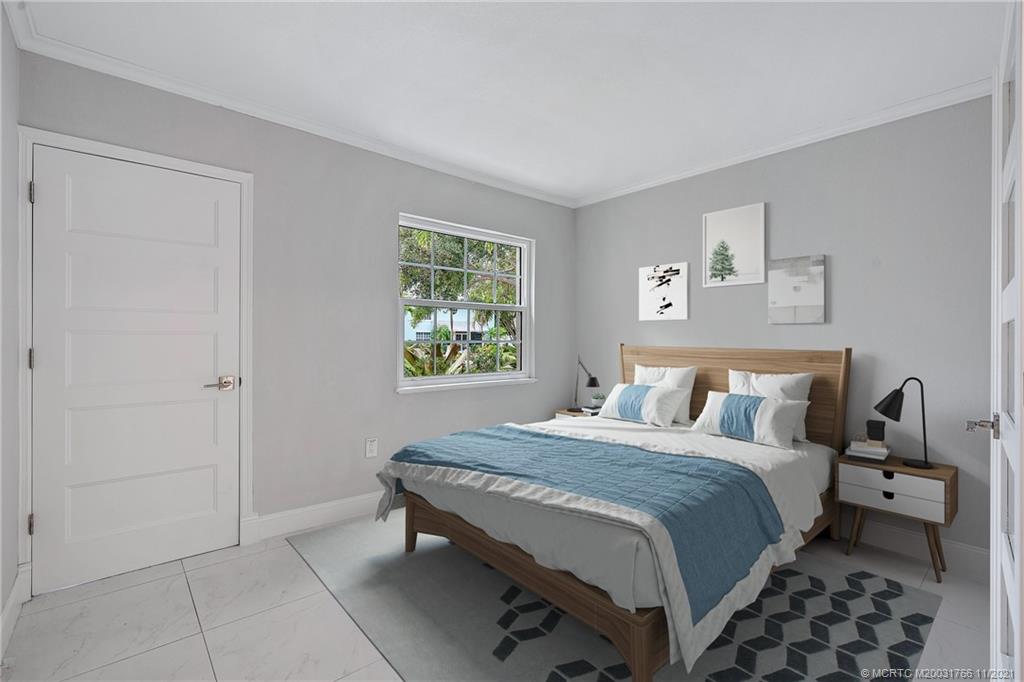 1037 Southeast Riverside Drive Stuart, FL 34996 - Photo 40 of 46 First Floor Middle Guest Bedroom, with virtual staging.