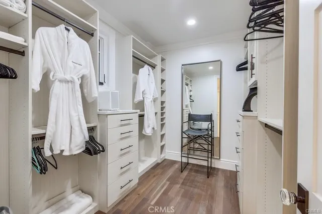 a view of walk in closet with white walls