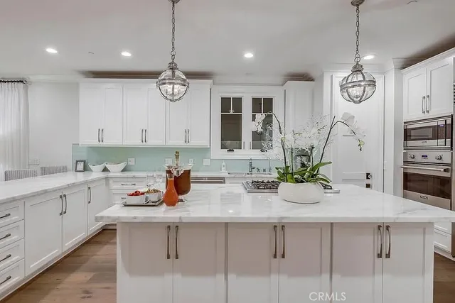 a kitchen with sink cabinets and window