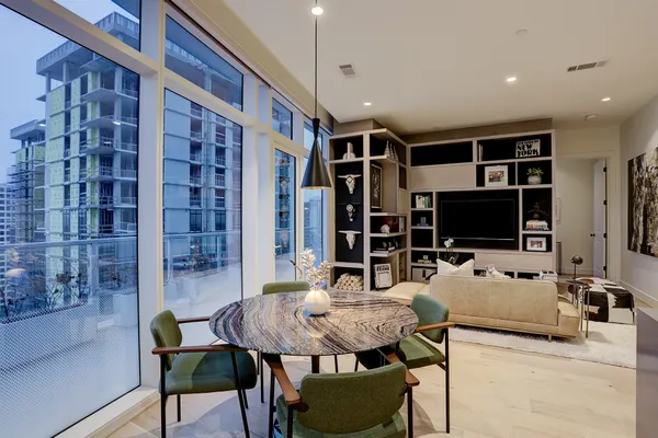 a living room with furniture a window and a fireplace