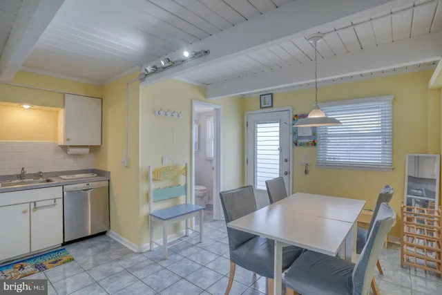 a view of a dining room with furniture and window
