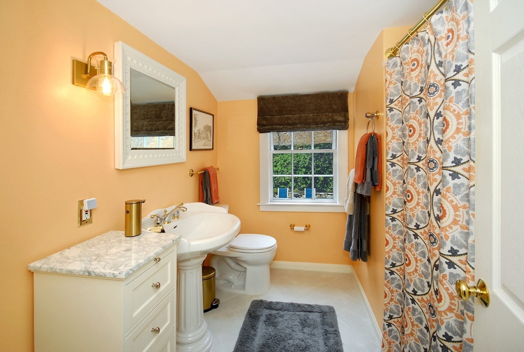 475 Lexington Road Concord, MA 01742 - Photo 27 of 42 a bathroom with a sink toilet and shower
