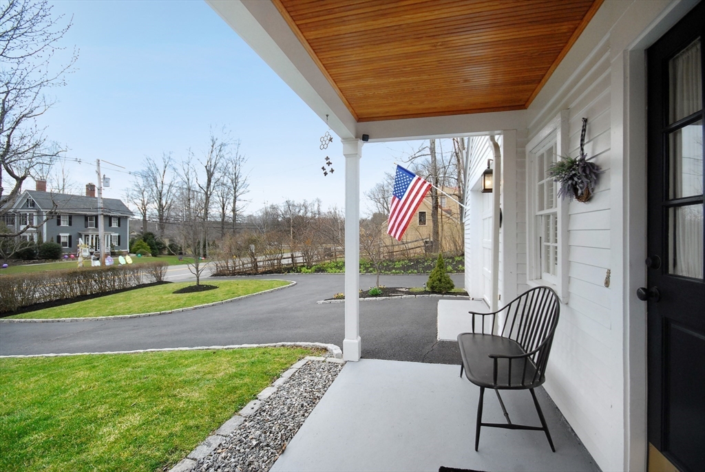 475 Lexington Road Concord, MA 01742 - Photo 41 of 42 a view of a porch with furniture and a yard