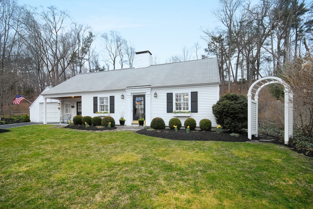 475 Lexington Road Concord, MA 01742 - Photo 42 of 42 a front view of a house with a garden and yard