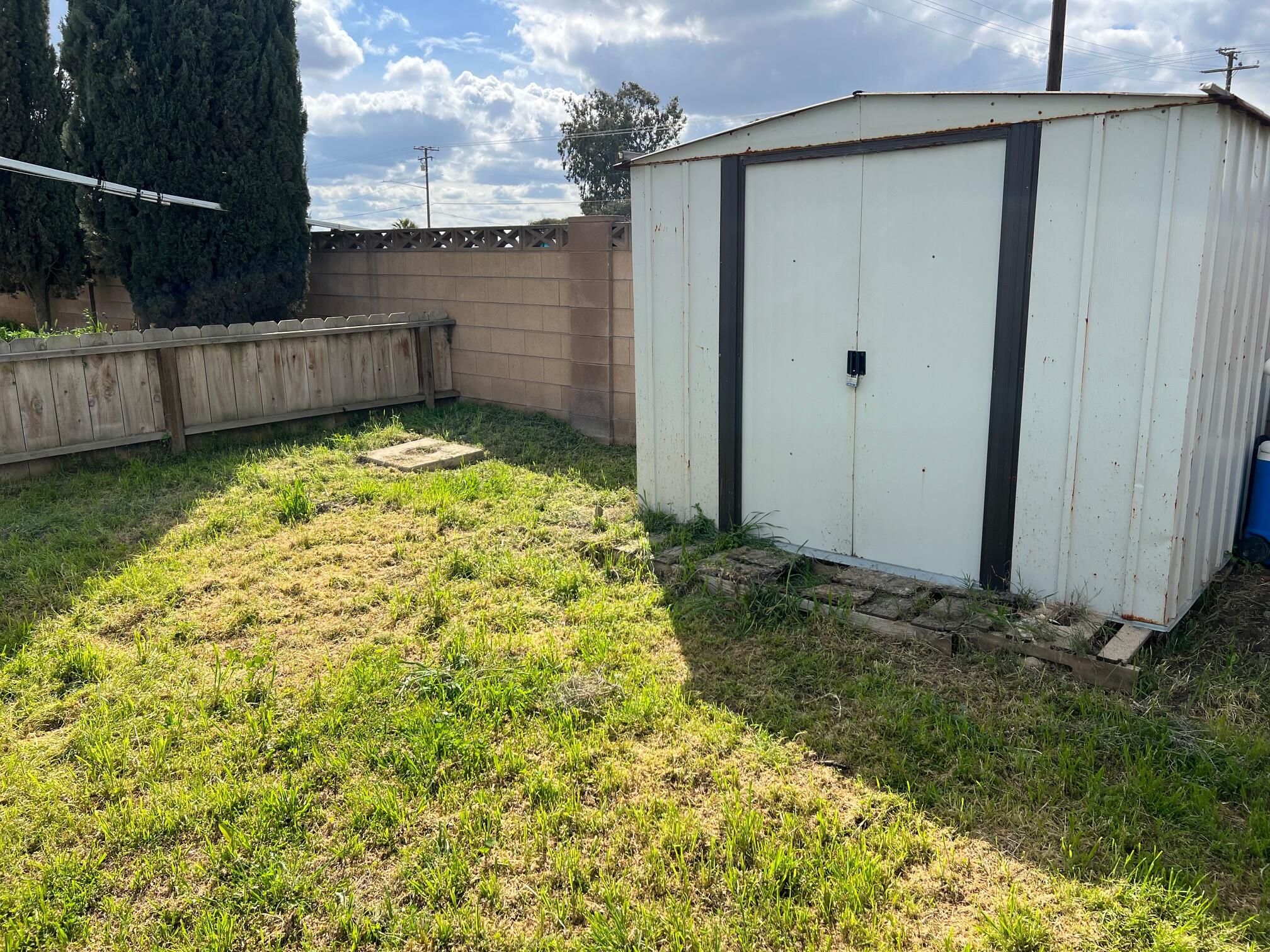 900 East Rankin Road, Unit 5 Tulare, CA 93274 - Photo 17 of 26 a view of back yard of the house and a yard