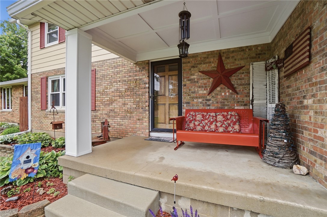 4170 Johnson Road Springfield, OH 45502 - Photo 8 of 54 A welcoming front porch, shaded by an overhang, creates a cozy entry.