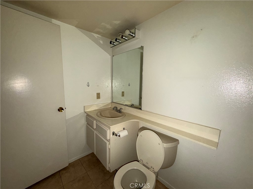 269 Alder Court Azusa, CA 91702 - Photo 9 of 14 a spacious bathroom with a granite countertop sink a toilet and a mirror