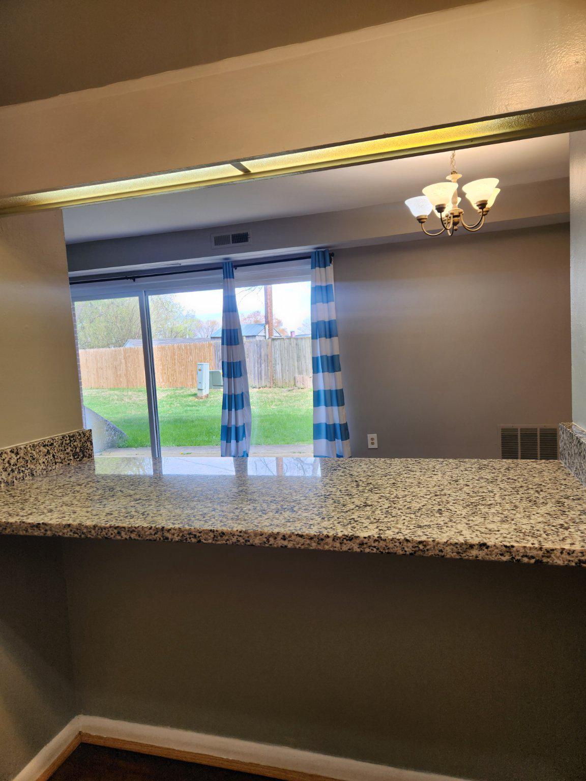 207 Erin Way, Unit T4 Reisterstown, MD 21136 - Photo 11 of 28 Breakfast bar with scenic backyard view.