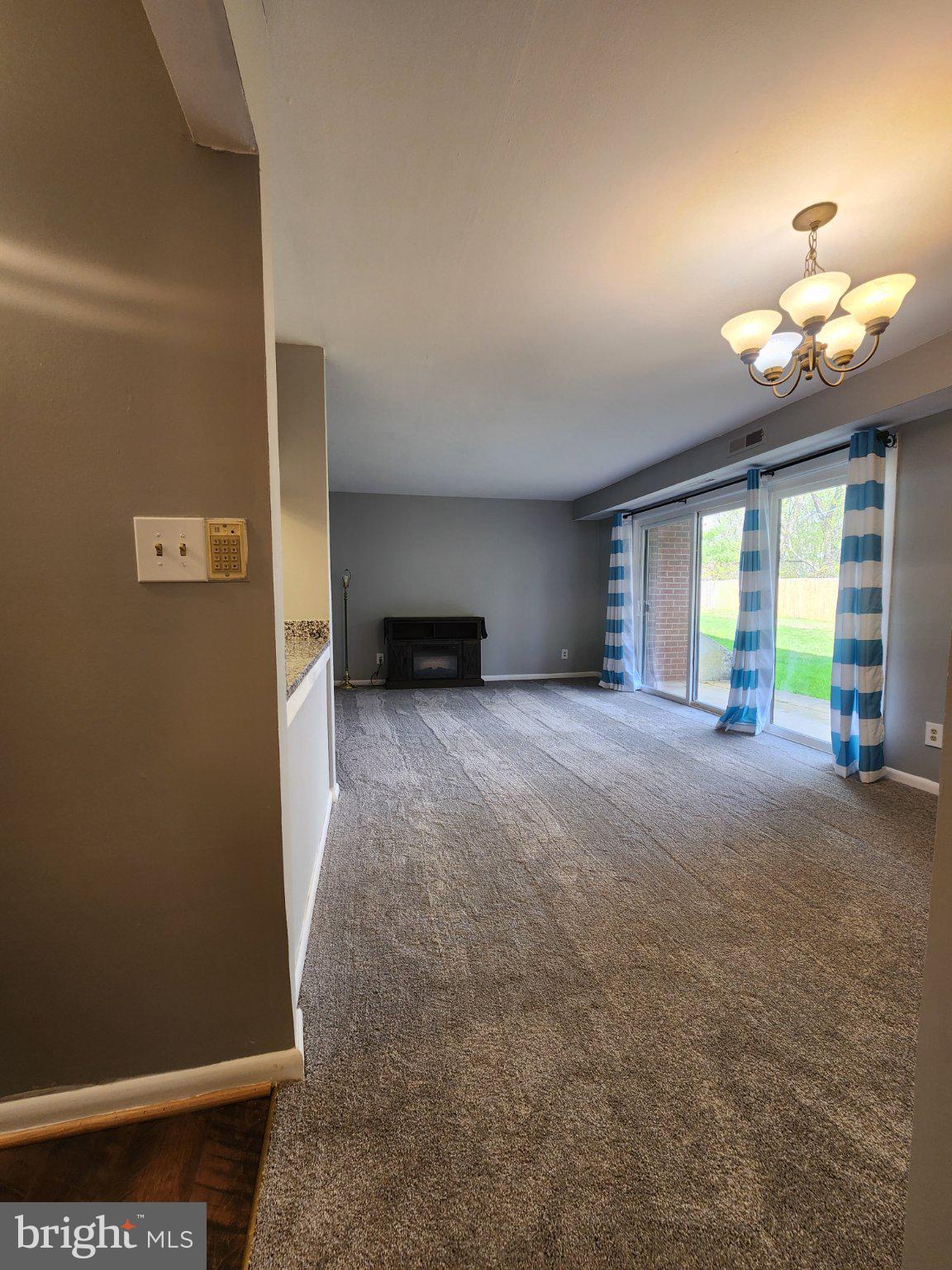 207 Erin Way, Unit T4 Reisterstown, MD 21136 - Photo 21 of 28 Bright living/dining area.