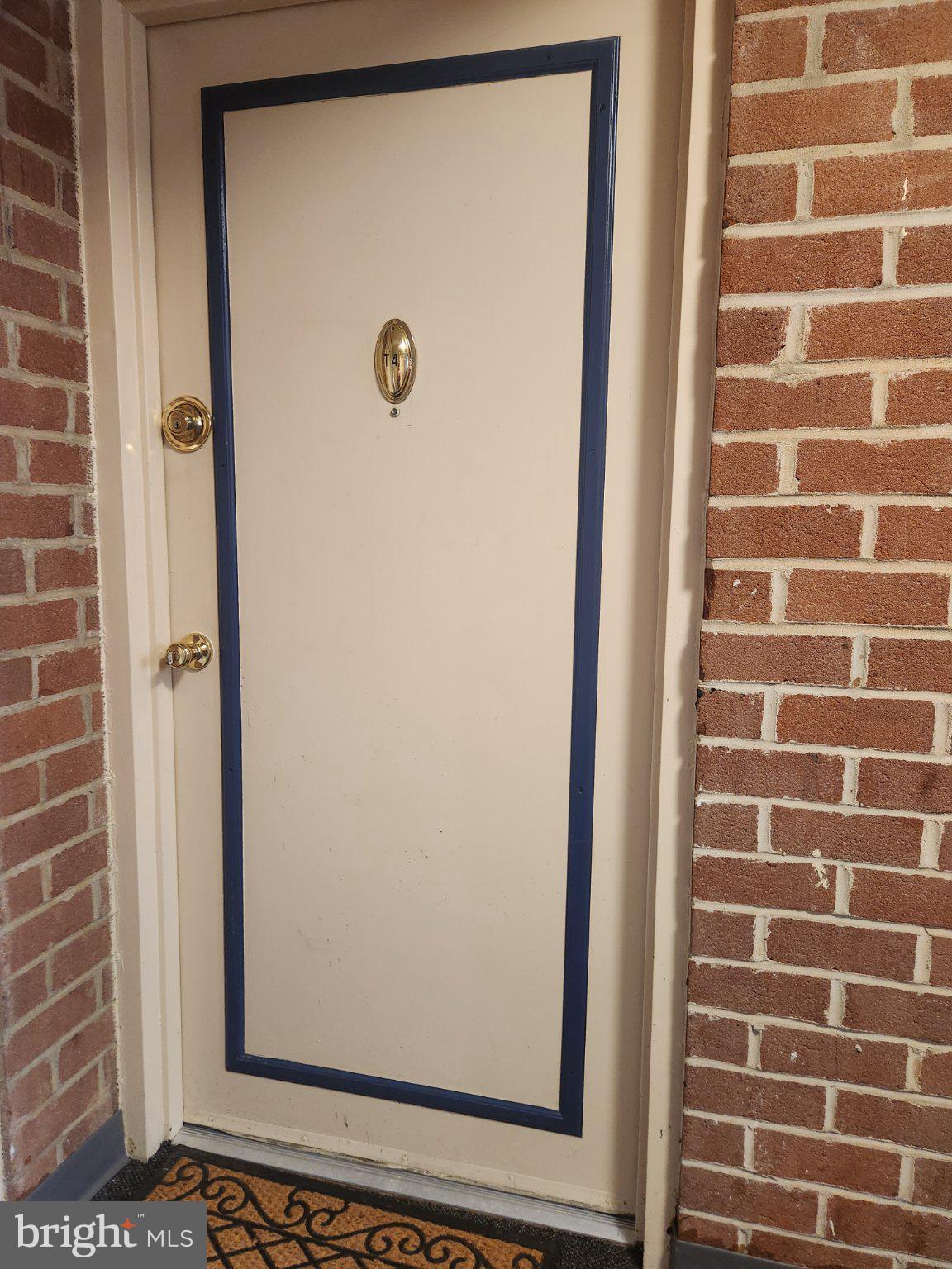 207 Erin Way, Unit T4 Reisterstown, MD 21136 - Photo 23 of 28 Charming entryway with brick backdrop.